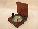 Antique mahogany cased needle pocket compass with twin sight vanes.